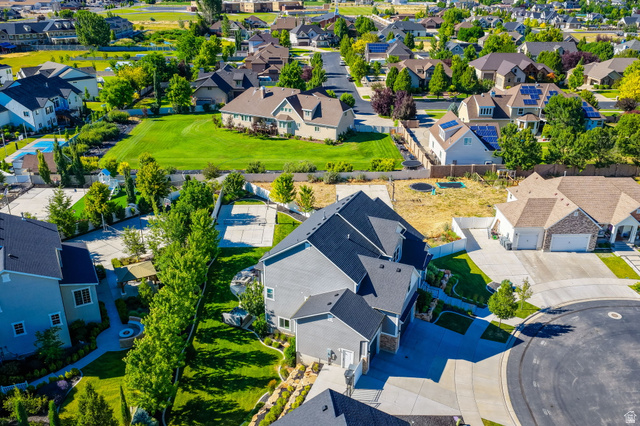 1132 South 1300th Street West Mapleton, UT 84664 - Photo 52 of 52 Aerial perspective showcasing a residential neighborhood with diverse architectural styles, featuring a cul-de-sac and established landscaping