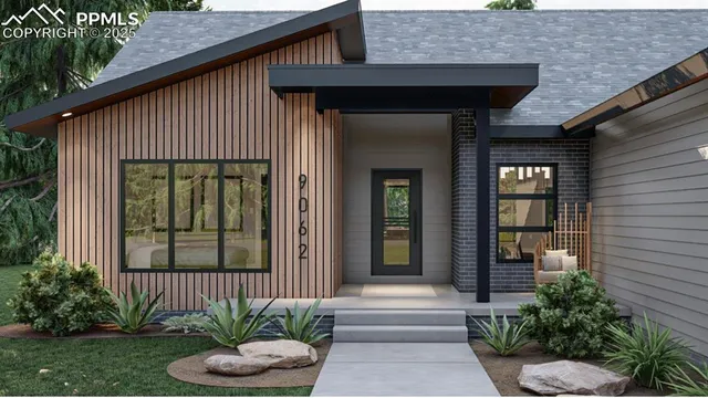 a front view of a house with garden