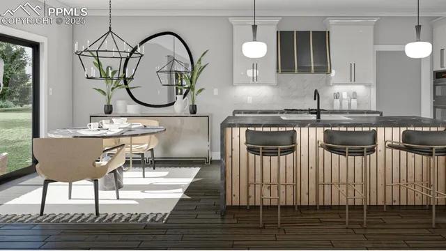 a kitchen with a table chairs and a dining table