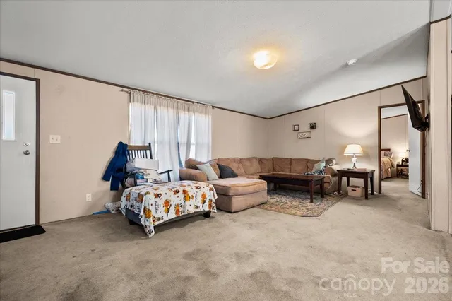 a bed room with furniture and a window