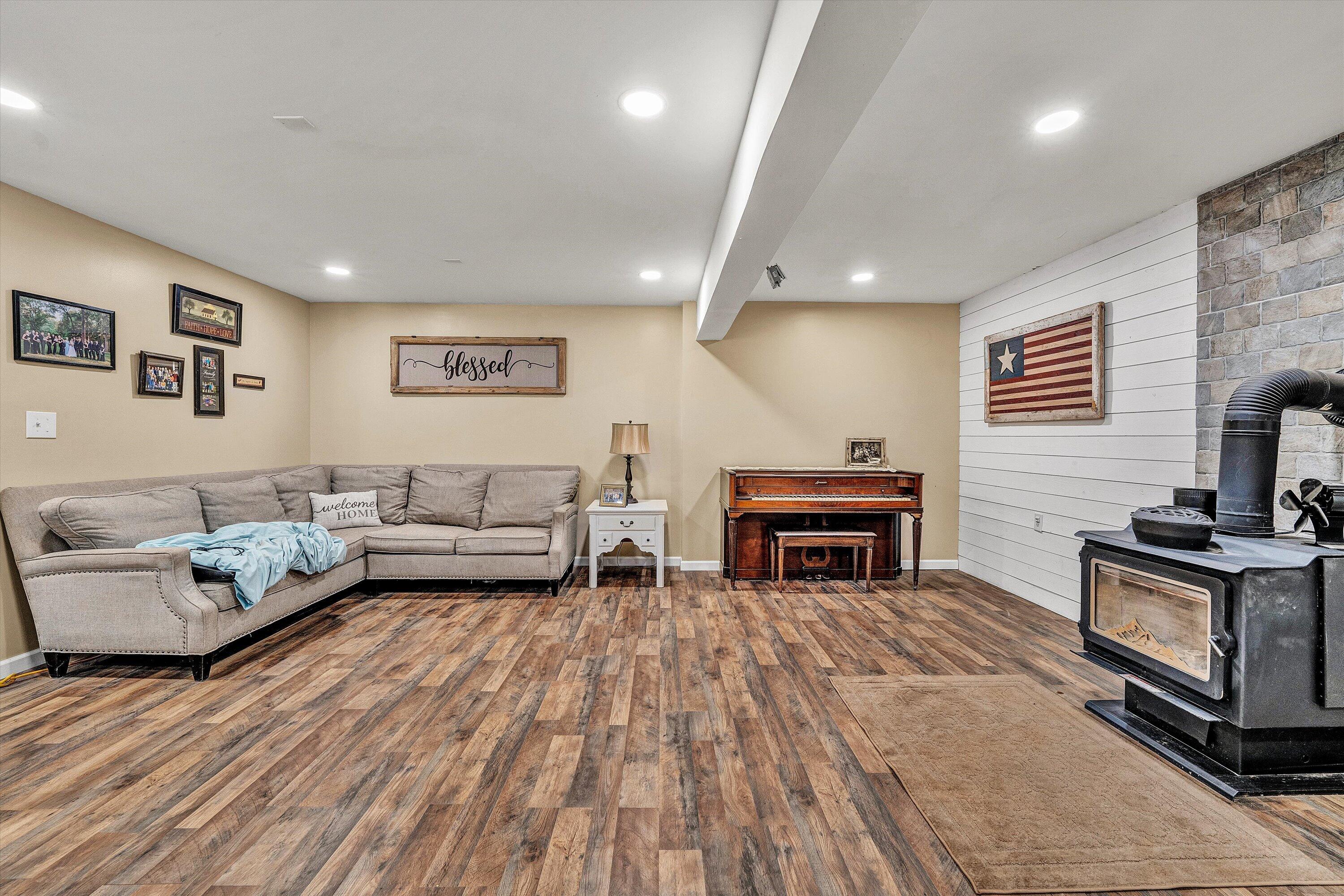 180 Thompson Ridge Circle Ferrum, VA 24088 - Photo 55 of 74 a living room with furniture and a fireplace