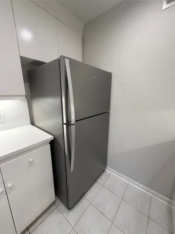 a kitchen with a stove and a microwave
