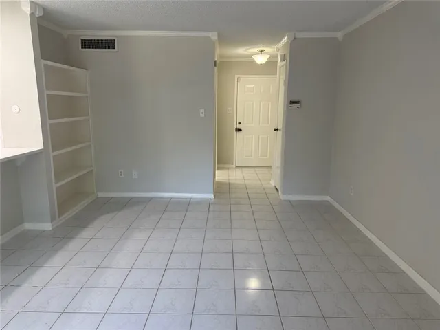 an empty room with shelves