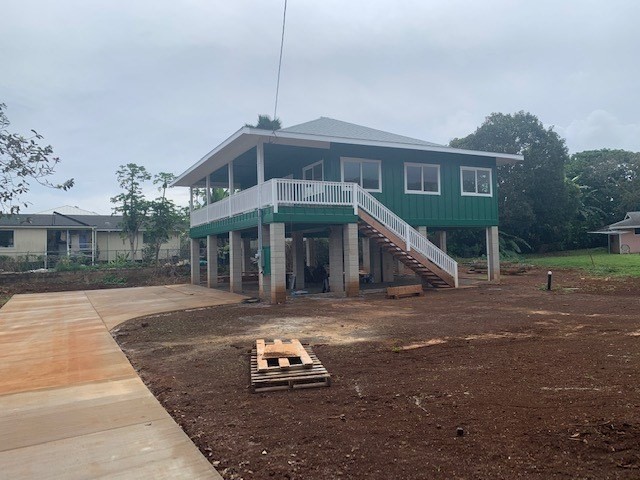 402 Pua Road, Unit 2 Kapaa, HI 96746 - Photo 1 of 3 a front view of a house with a yard