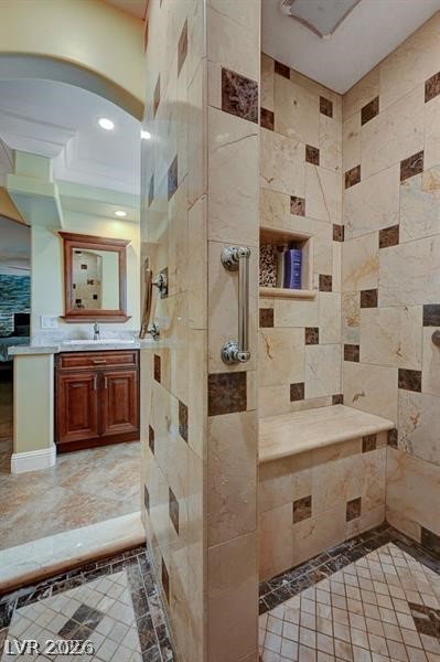 2410 Doherty Way Henderson, NV 89014 - Photo 49 of 63 Bathroom with tiled shower, vanity, recessed lighting, and tile walls