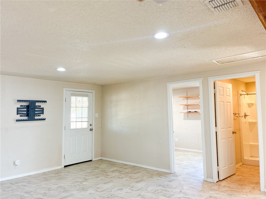 Undisclosed Address Three Rivers, TX 78071 - Photo 7 of 12 an empty room with windows and closet
