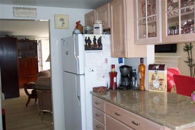 Undisclosed Address Falmouth, MA 02536 - Photo 3 of 4 a kitchen with a refrigerator and a sink