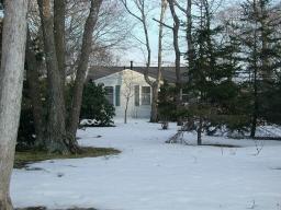Undisclosed Address Falmouth, MA 02536 - Photo 4 of 4 a view of a house with a yard and tree s