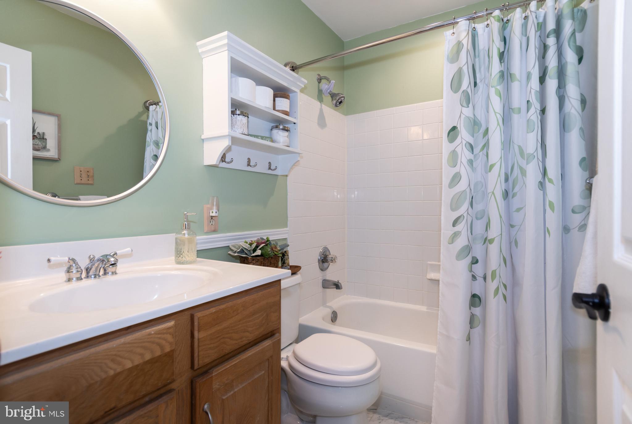 2861 Cox Neck Road Chester, MD 21619 - Photo 45 of 79 a bathroom with a sink toilet and shower