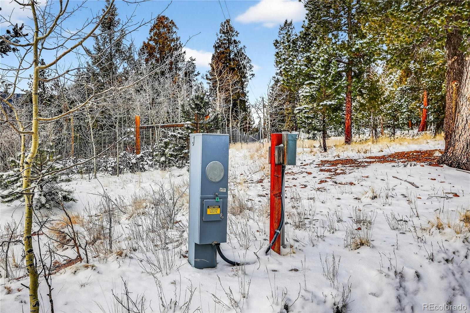 927 Forest Drive Bailey, CO 80421 - Photo 15 of 19 a tall building with trees in the background