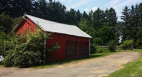 6387 Highway 41 Homer, NY 13077 - Photo 3 of 5 a view of barn with a small yard