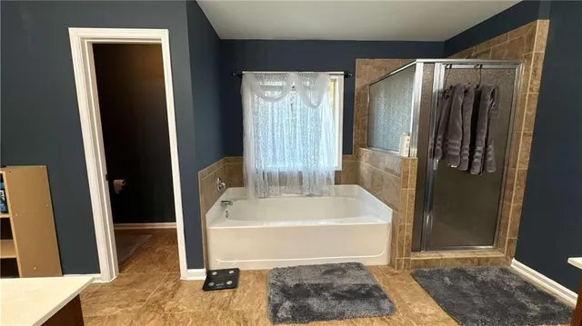 a white bath tub sitting in a bathroom