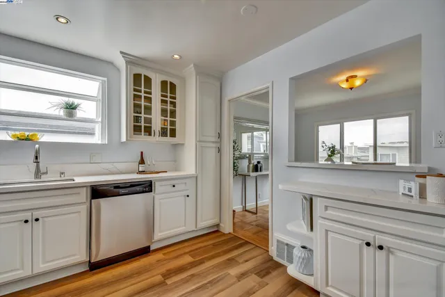 a kitchen with a sink and cabinets