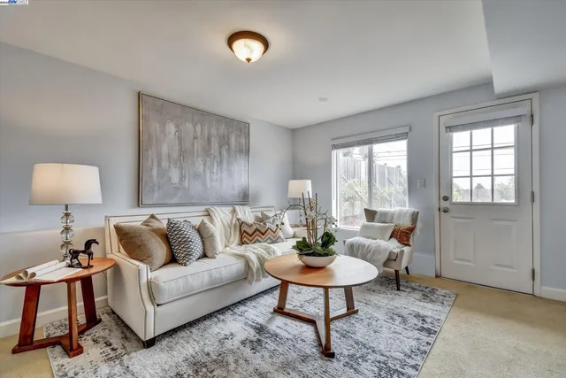 a living room with furniture and a rug