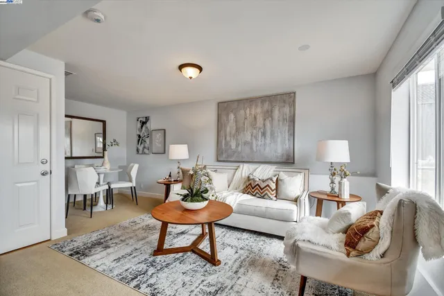 a living room with furniture and a lamp