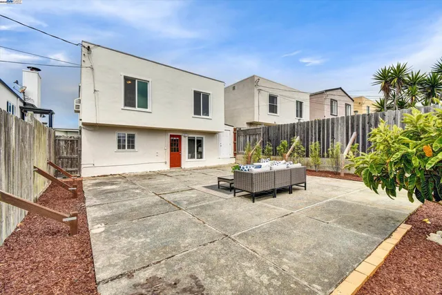 a house view with a sitting space and garden space