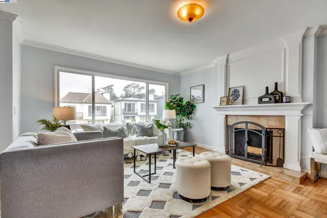 a living room with furniture and a fireplace