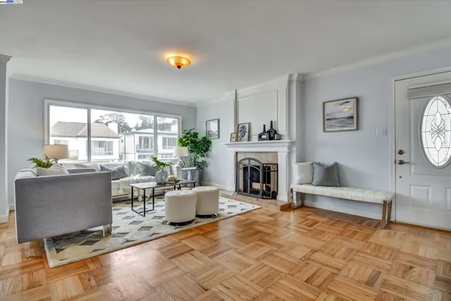a living room with furniture a fireplace and a table