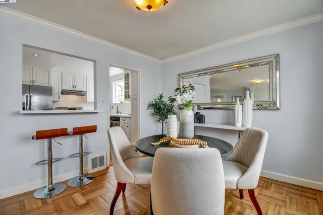 a dining room with furniture and wooden floor