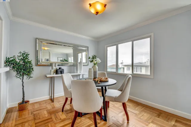 a dining room with furniture and window