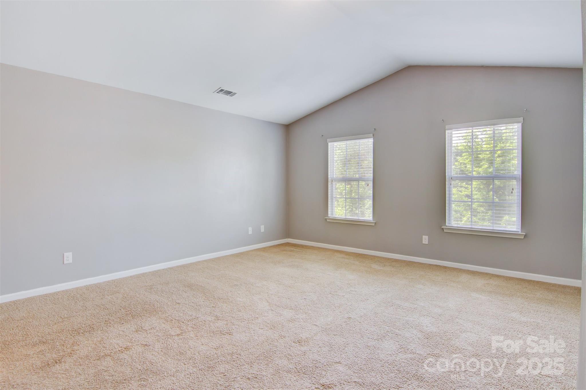 5311 Oakdale Ridge Road Charlotte, NC 28216 - Photo 17 of 35 an empty room with windows