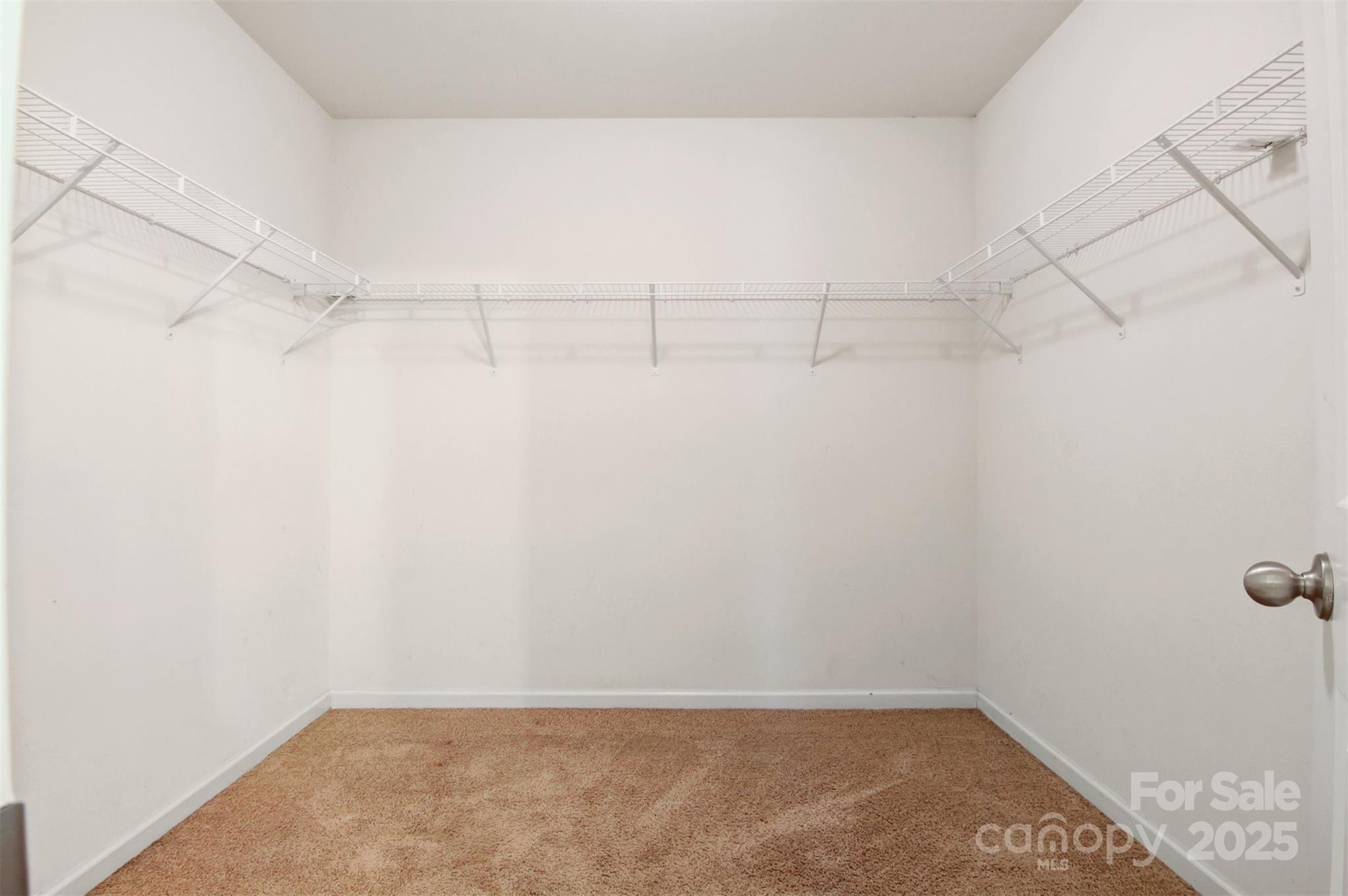 5311 Oakdale Ridge Road Charlotte, NC 28216 - Photo 21 of 35 a view of a room with racks on the wall