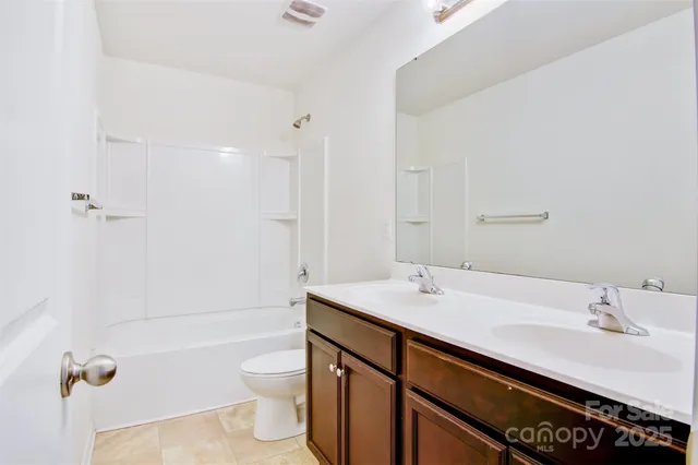 a bathroom with a sink a toilet and a bathtub