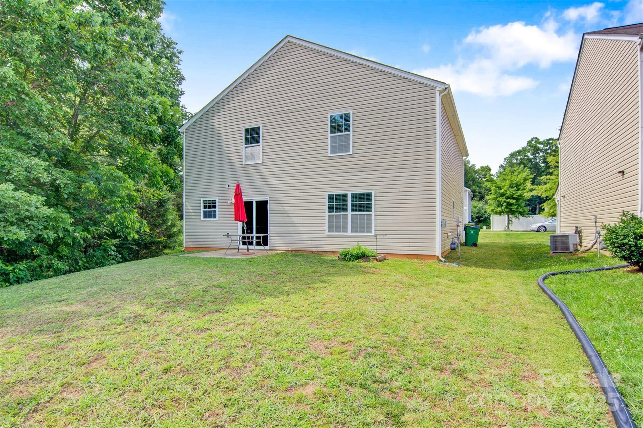 5311 Oakdale Ridge Road Charlotte, NC 28216 - Photo 30 of 35 a house view with a backyard space