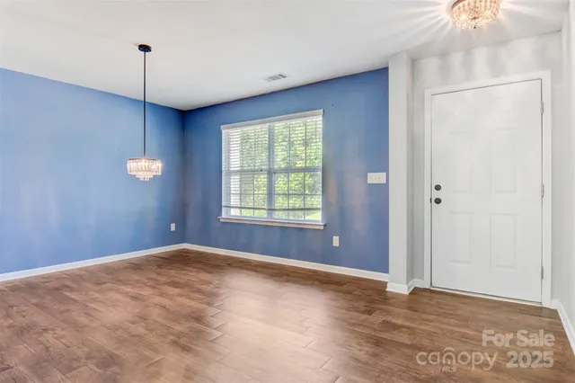 a view of a livingroom with a ceiling fan and window