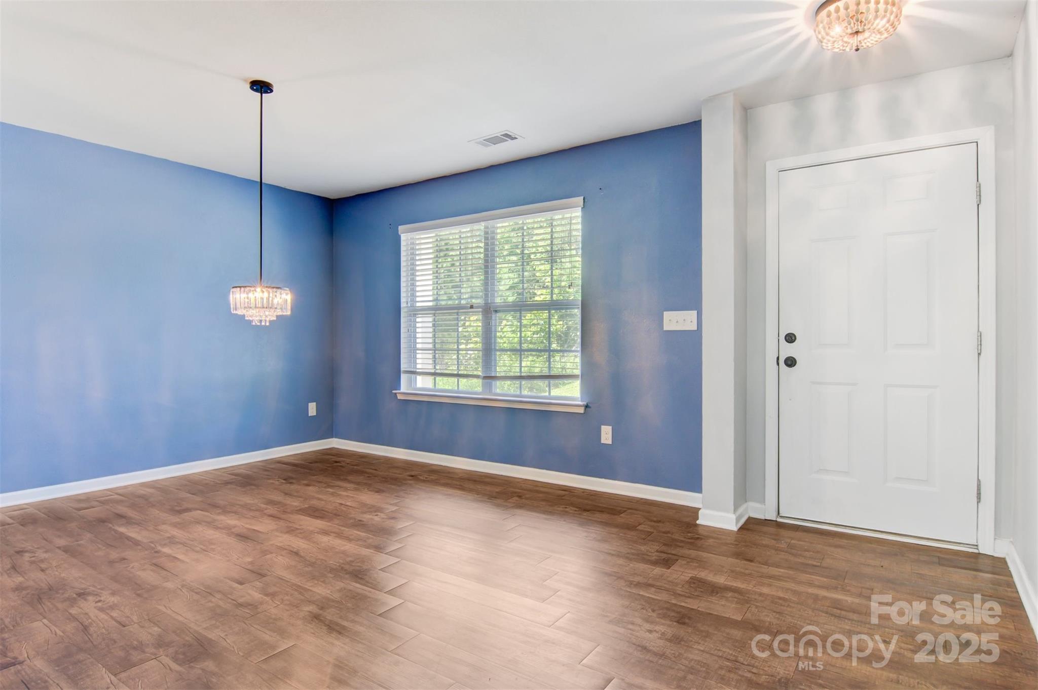 5311 Oakdale Ridge Road Charlotte, NC 28216 - Photo 4 of 35 a view of a livingroom with a ceiling fan and window