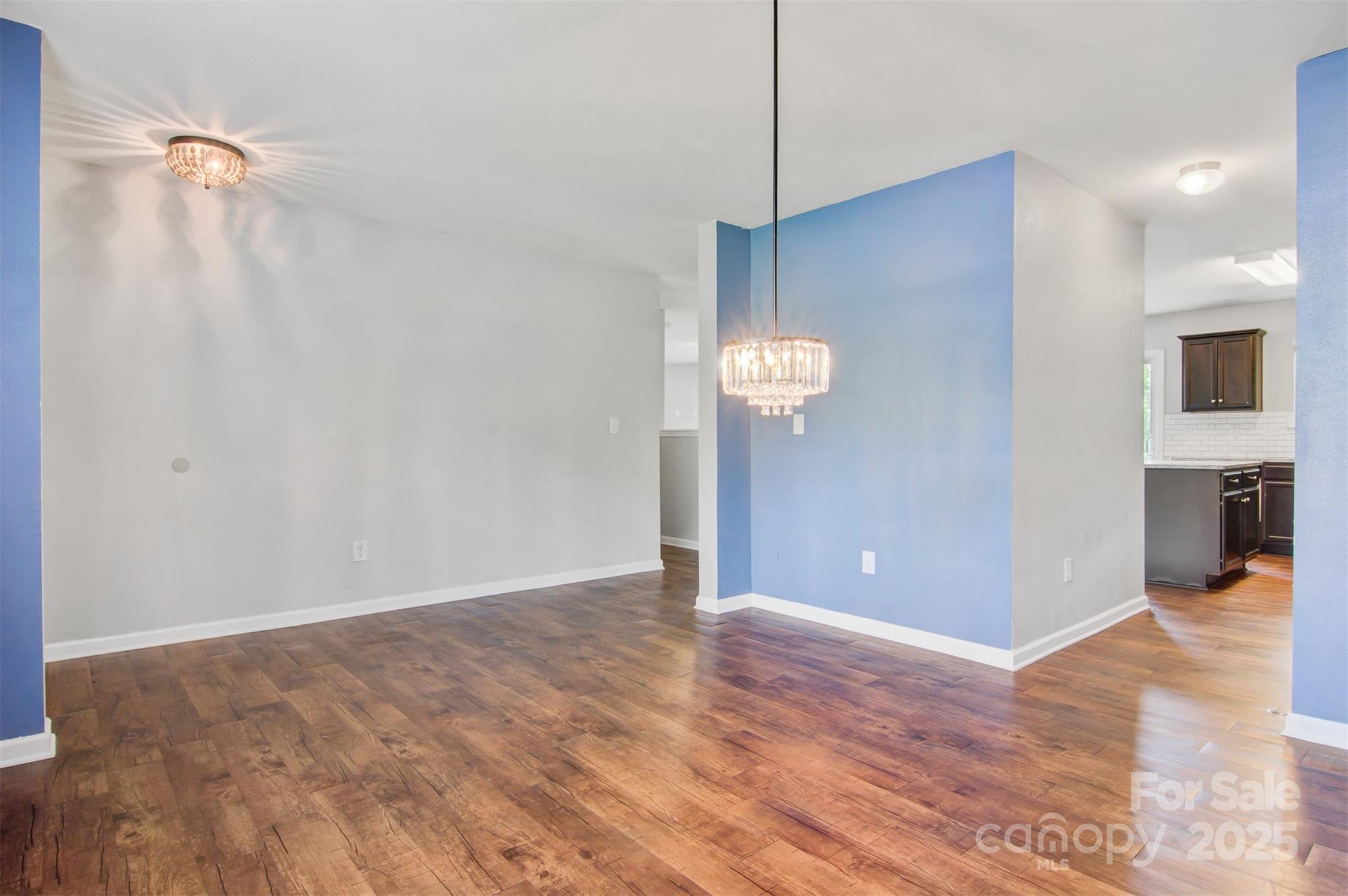5311 Oakdale Ridge Road Charlotte, NC 28216 - Photo 7 of 35 a view of empty room with wooden floor
