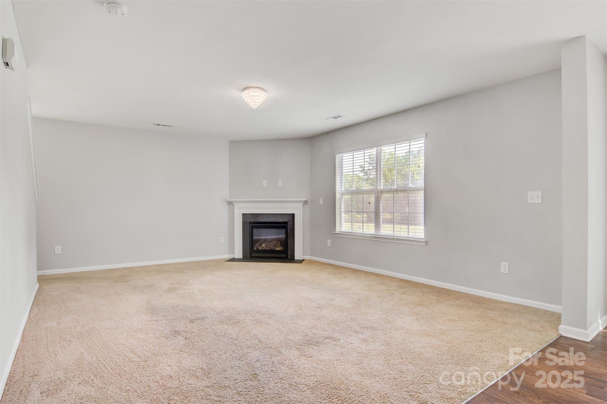 5311 Oakdale Ridge Road Charlotte, NC 28216 - Photo 8 of 35 an empty room with windows