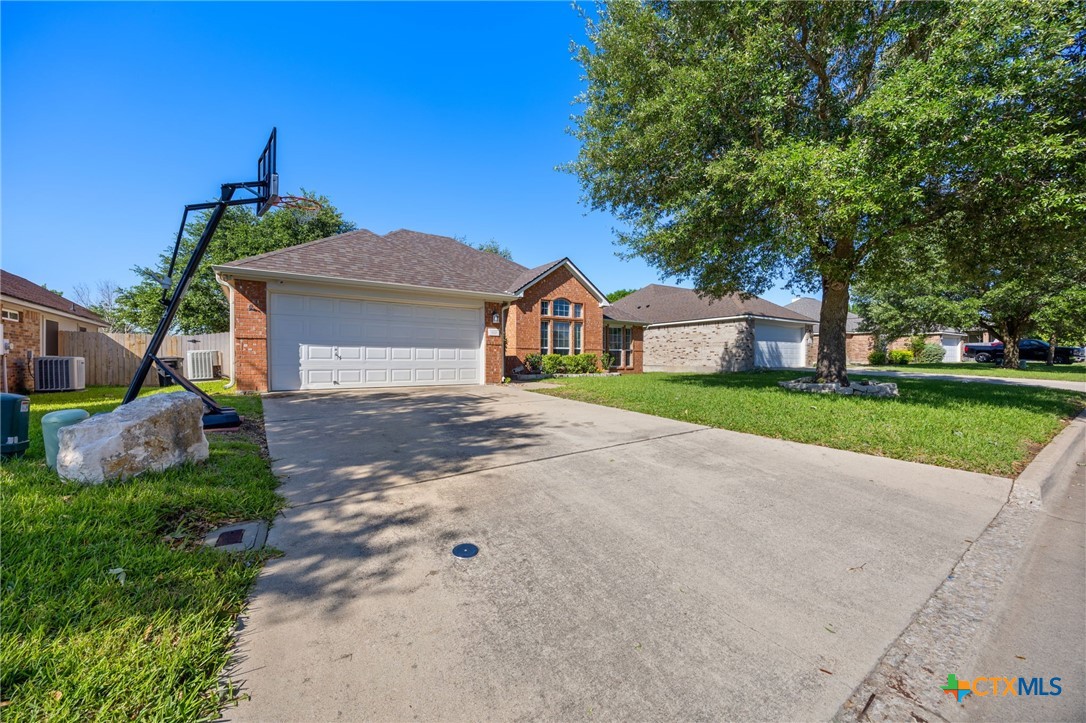 910 Neuberry Cliffe Temple, TX 76502 - Photo 2 of 32 a front view of a house with a yard