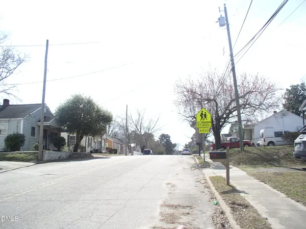 a view of a street with houses