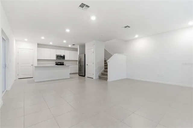 a view of a kitchen with a sink and a stove top oven