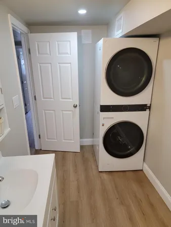 a view of a hallway with washer and dryer