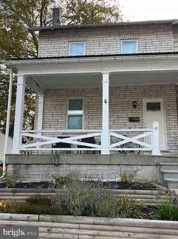 an outdoor view of house with yard