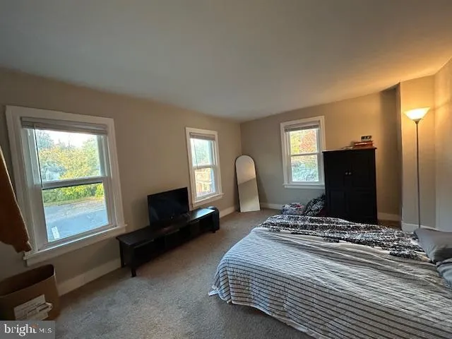 a room with furniture and a dresser