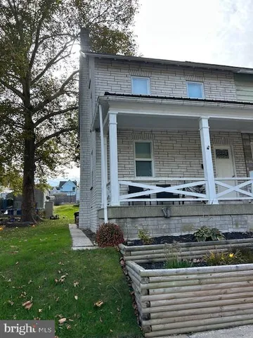 a front view of house with yard