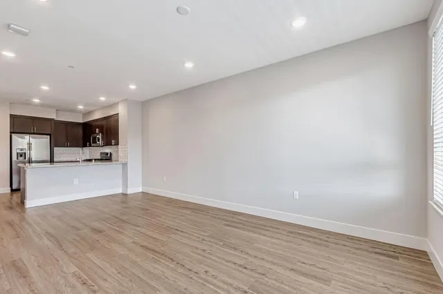 a view of kitchen with wooden floor