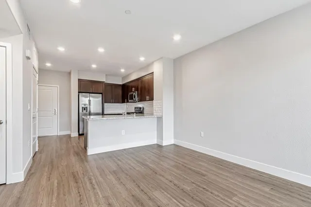 a view of kitchen with wooden floor