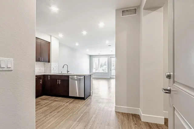a view of a kitchen from the hallway