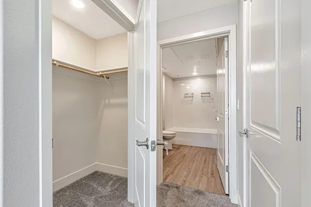 a view of a bathroom with a glass shower door