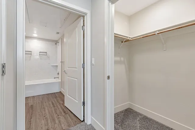 a bathroom with a bathtub and a shower