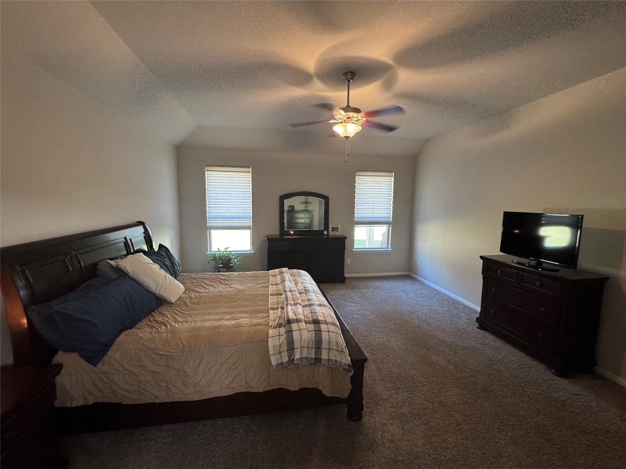 4507 Axis Trail Conroe, TX 77303 - Photo 14 of 34 a bedroom with bed and window with lamp