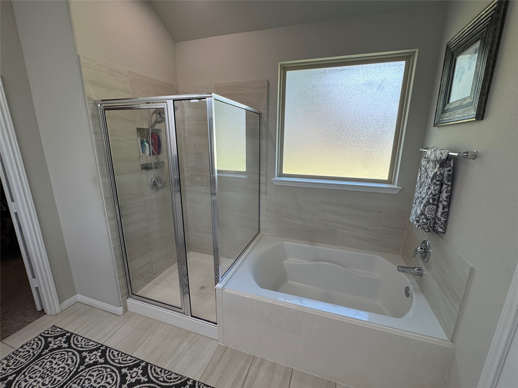 4507 Axis Trail Conroe, TX 77303 - Photo 17 of 34 a bathroom with a bathtub