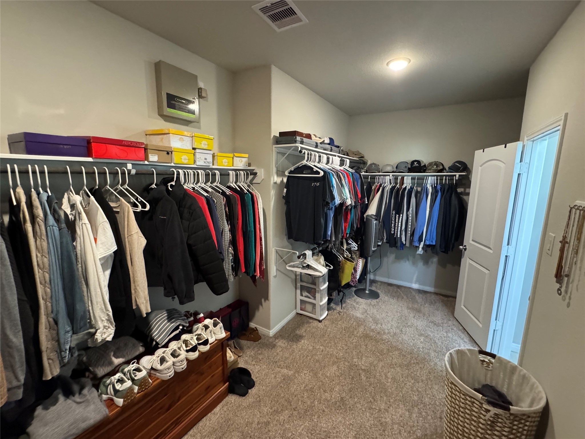 4507 Axis Trail Conroe, TX 77303 - Photo 18 of 34 a view of walk in closet with clothes