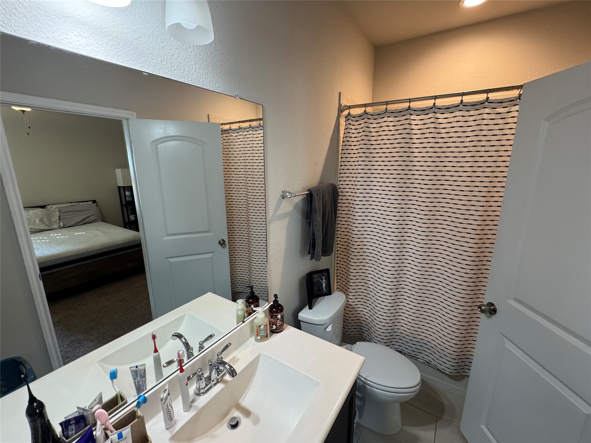 4507 Axis Trail Conroe, TX 77303 - Photo 20 of 34 a bathroom with a sink and a mirror