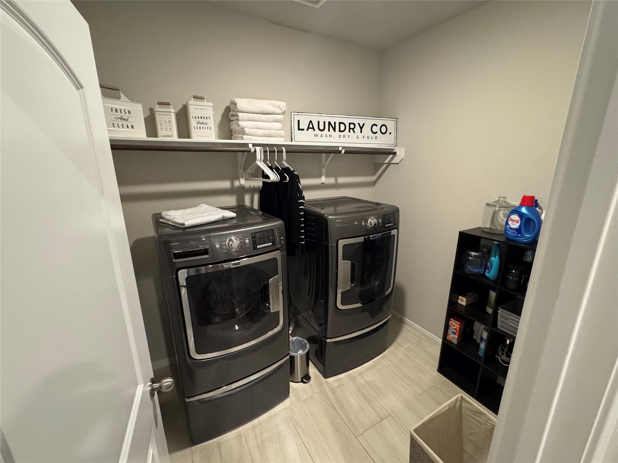 4507 Axis Trail Conroe, TX 77303 - Photo 24 of 34 a utility room with dryer and washer