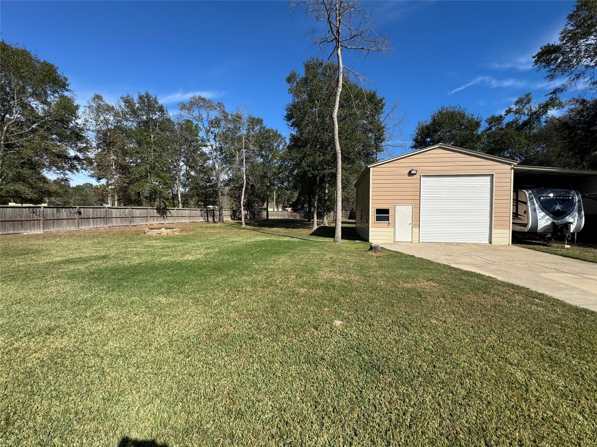 4507 Axis Trail Conroe, TX 77303 - Photo 25 of 34 a front view of a house with a yard and garage